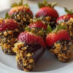 Close-up of several Dark Chocolate Toffee Crusted Strawberries dipped in dark chocolate and covered in crunchy toffee bits.