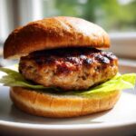 Close-up of a juicy Air Fryer Turkey Burger patty served on a toasted bun with crisp lettuce.