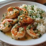 Close-up of Garlic Butter Shrimp and Rice Skillet, featuring juicy shrimp coated in garlic butter sauce next to fluffy rice.