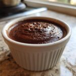 Close-up of rich, dark Vegan Chocolate Avocado Mousse served in a white, fluted ramekin.