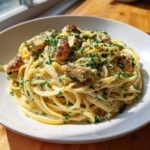 Close-up of Creamy Lemon Garlic Pasta with Chicken topped generously with fresh parsley.