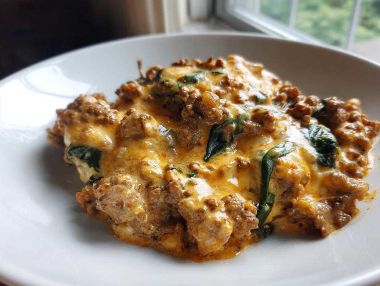 A close-up of a creamy, cheesy ground beef and spinach casserole, perfect for Easy Keto Meals for Weight Loss.