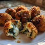 Close-up of crispy Knapperige Spinazie Bites met Feta, showing the melted cheese and spinach filling.